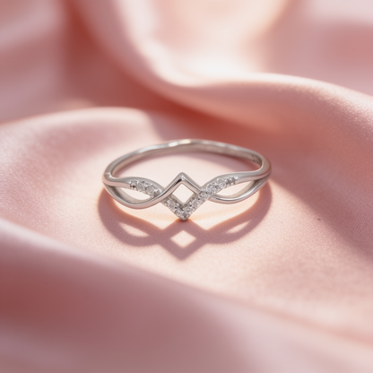 Aira 925 silver diamond infinity ring for women by Zyrene on pink satin background