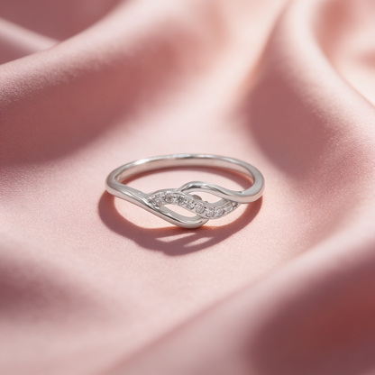 Anaya 925 silver infinity ring for women by Zyrene on pink satin background
