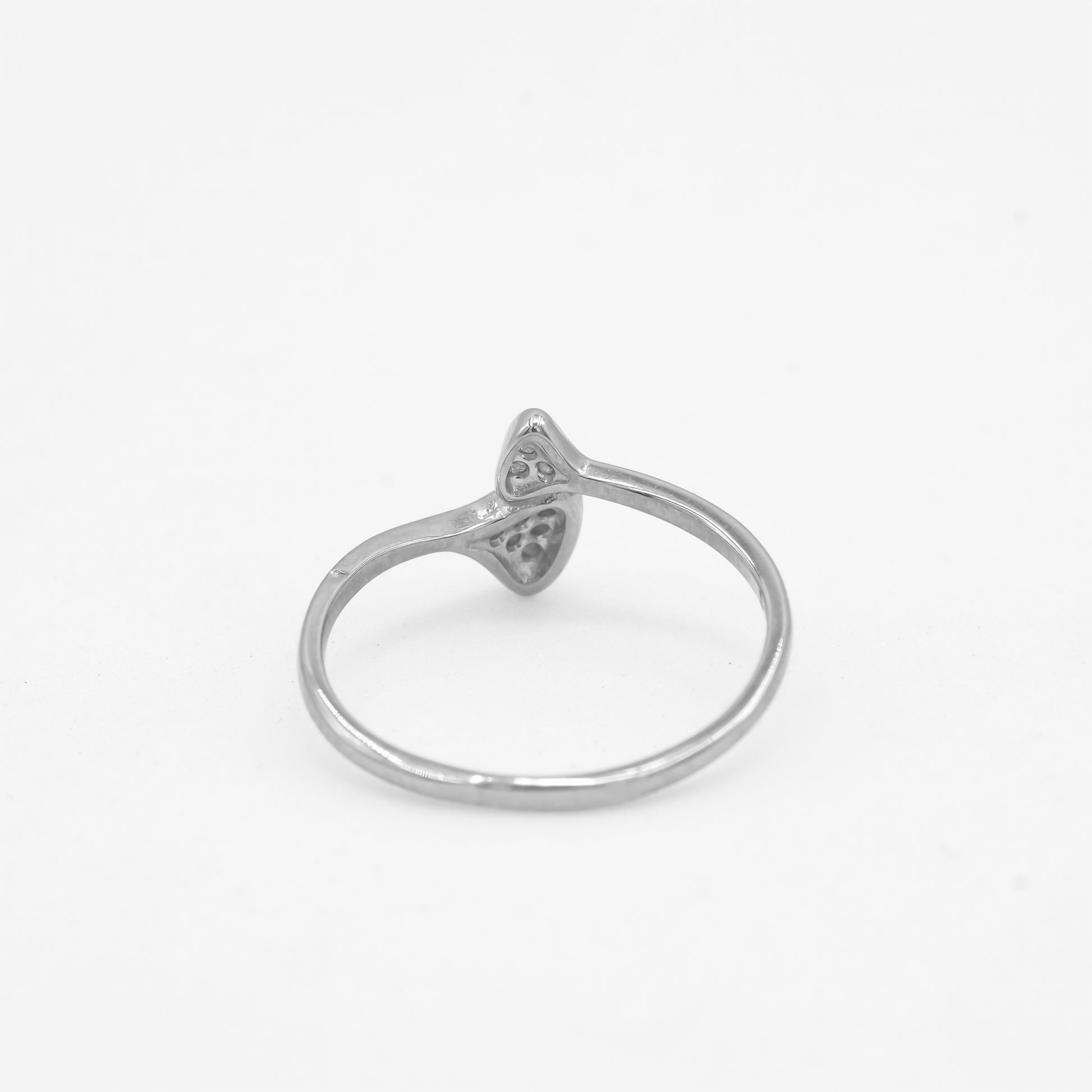 Side angle of Zyrene Liora 925 silver bow ring showing slim lightweight band