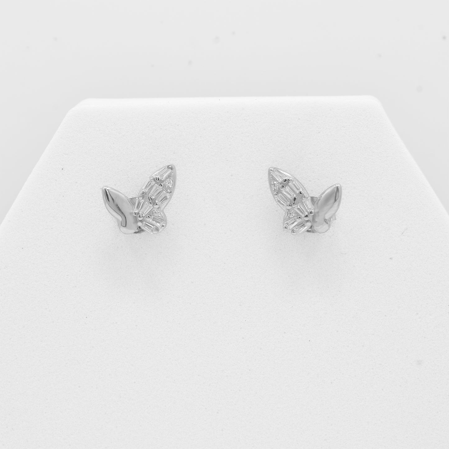 Close-up of Zyrene 925 silver butterfly earrings with crystal wing detailing