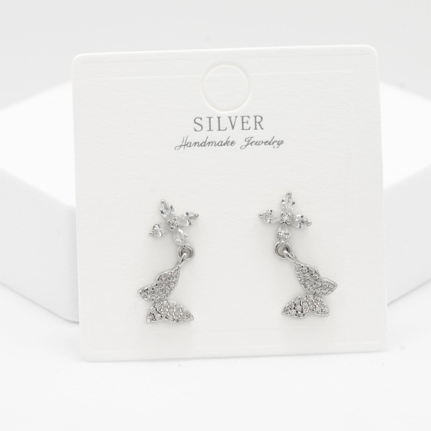 Front view of 925 silver floral butterfly earrings for women by Zyrene