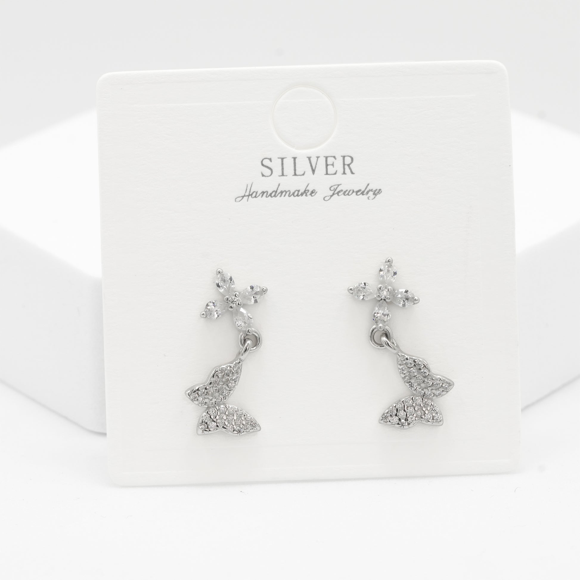 Front view of 925 silver floral butterfly earrings for women by Zyrene