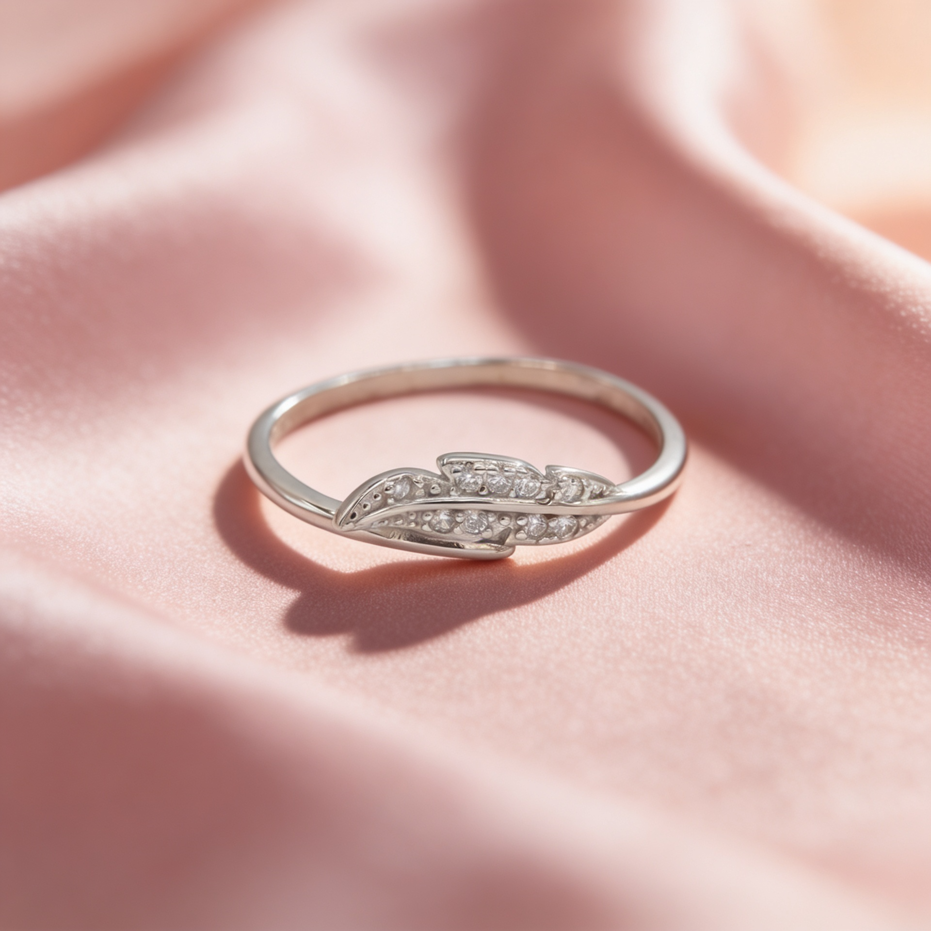Avni 925 silver feather leaf ring for women by Zyrene on pink satin background