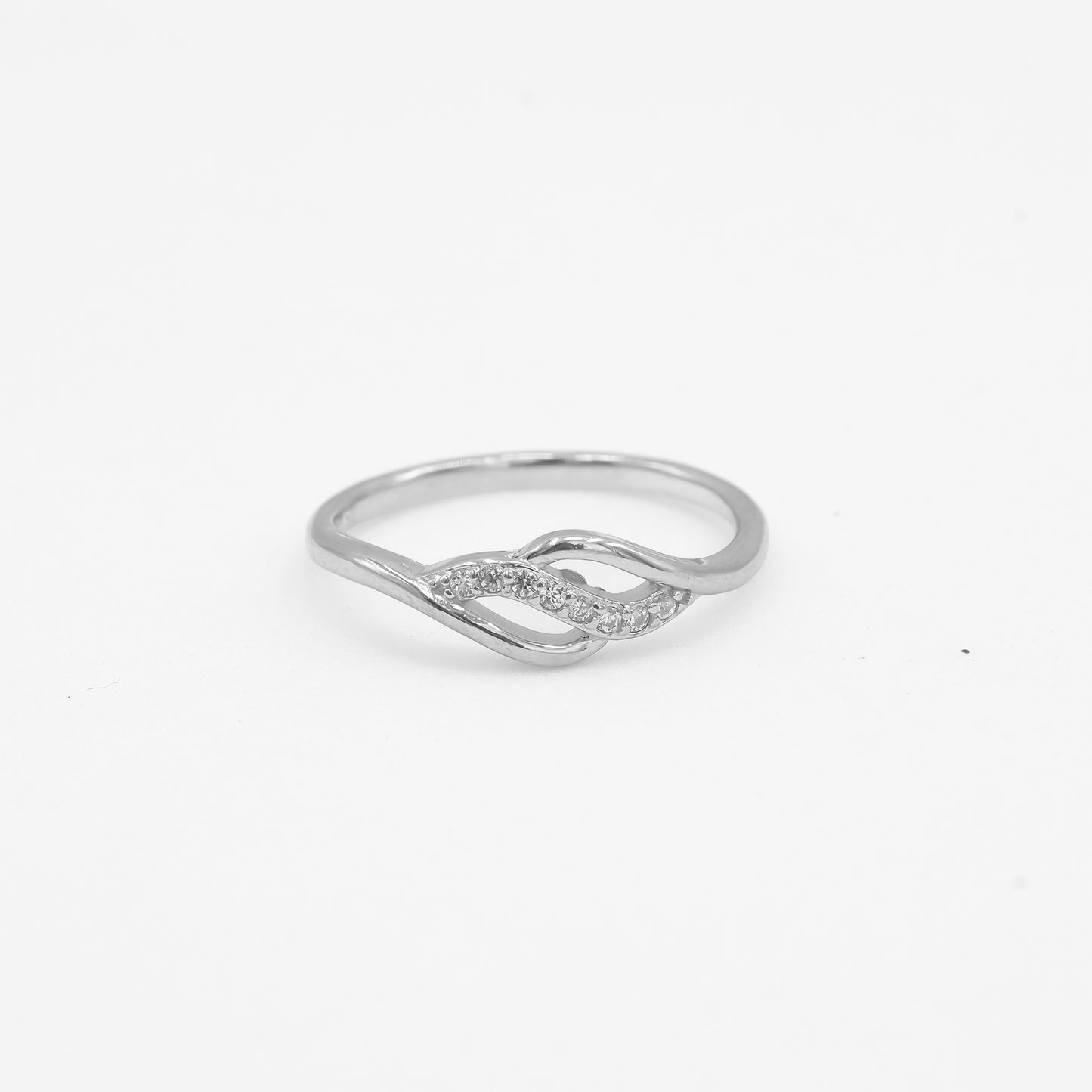 Close-up of Anaya 925 silver infinity twist ring with sparkle stone detailing