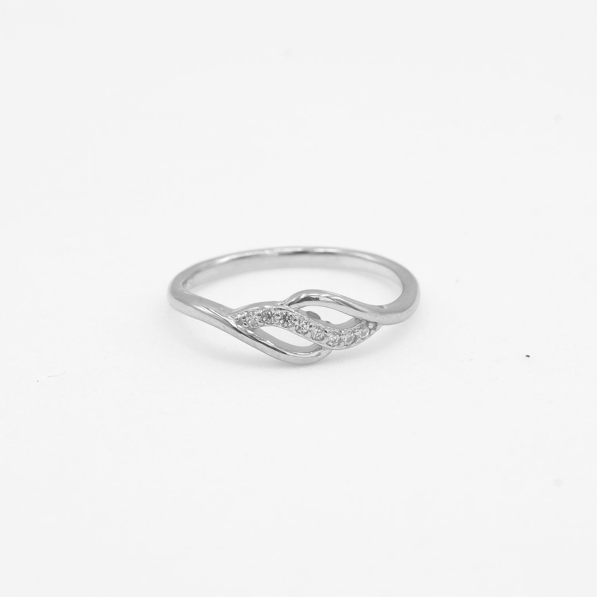 Close-up of Anaya 925 silver infinity twist ring with sparkle stone detailing