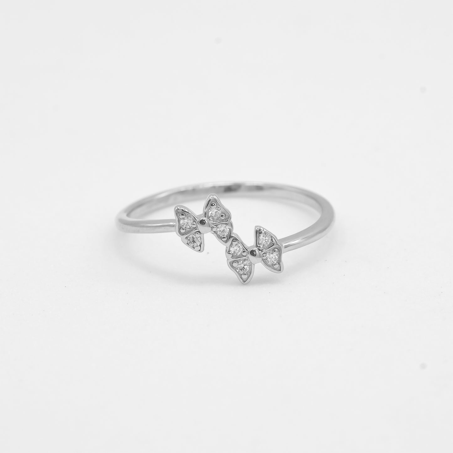 Close-up of Kyra 925 silver double butterfly ring with sparkle stone detailing