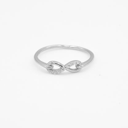 Close-up of Noor 925 silver infinity loop ring with sparkle stone detailing