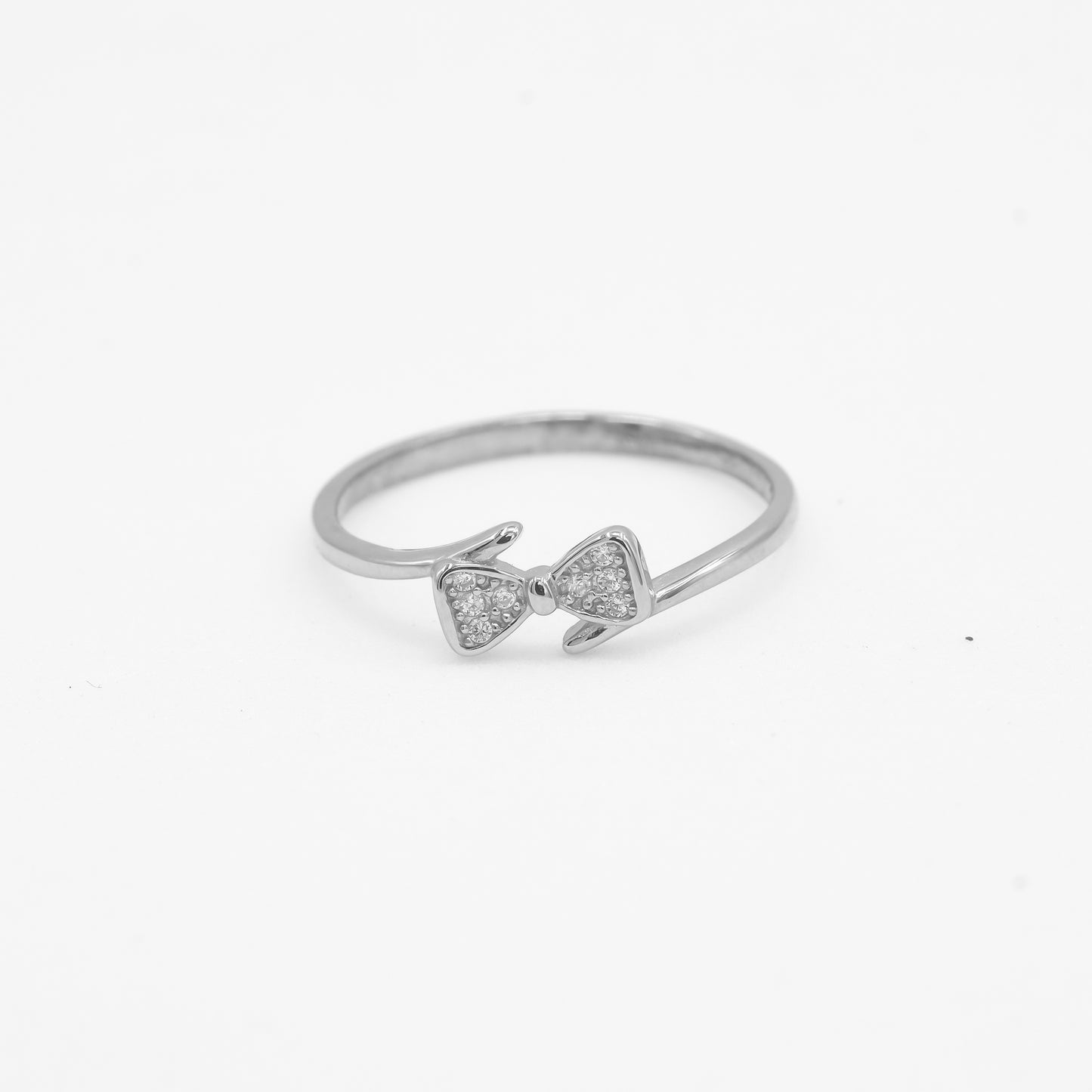 Close-up of Naira 925 silver bow ring with sparkle stone detailing