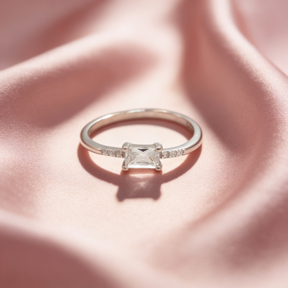 Mishka 925 silver solitaire ring for women by Zyrene on pink satin background