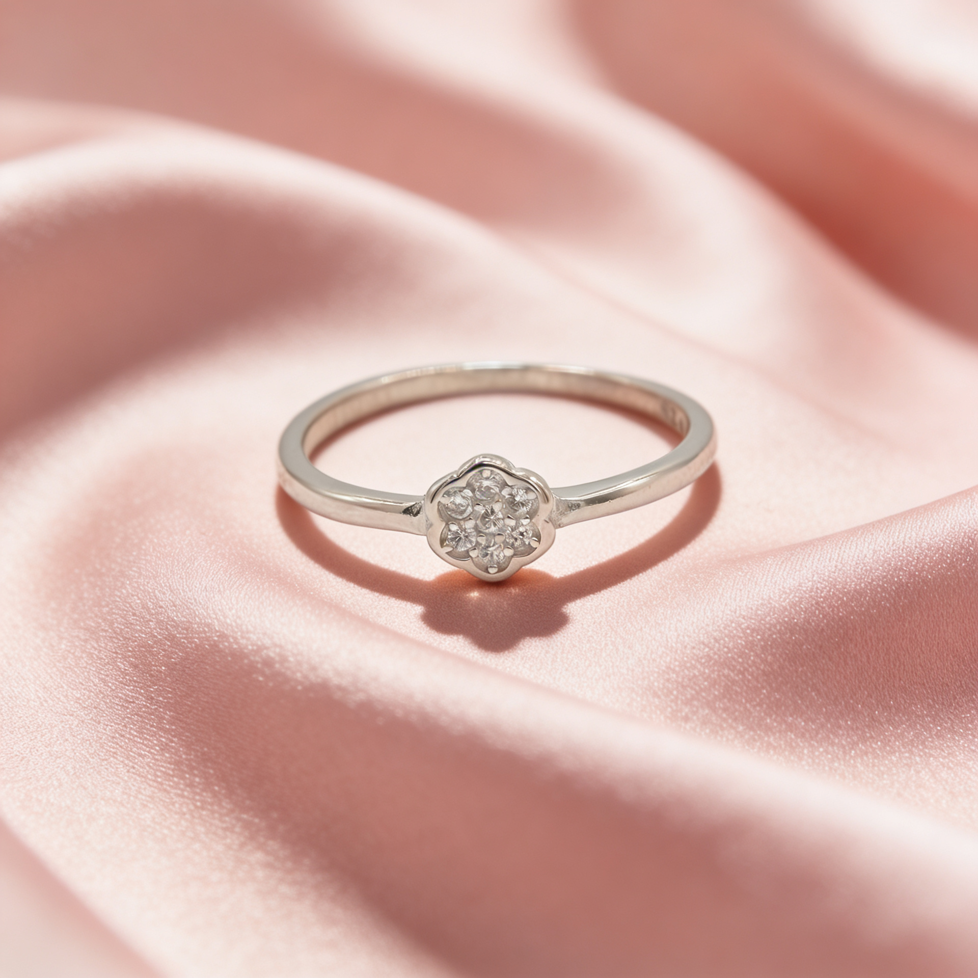 Nira 925 silver flower sparkle ring for women by Zyrene on pink satin background