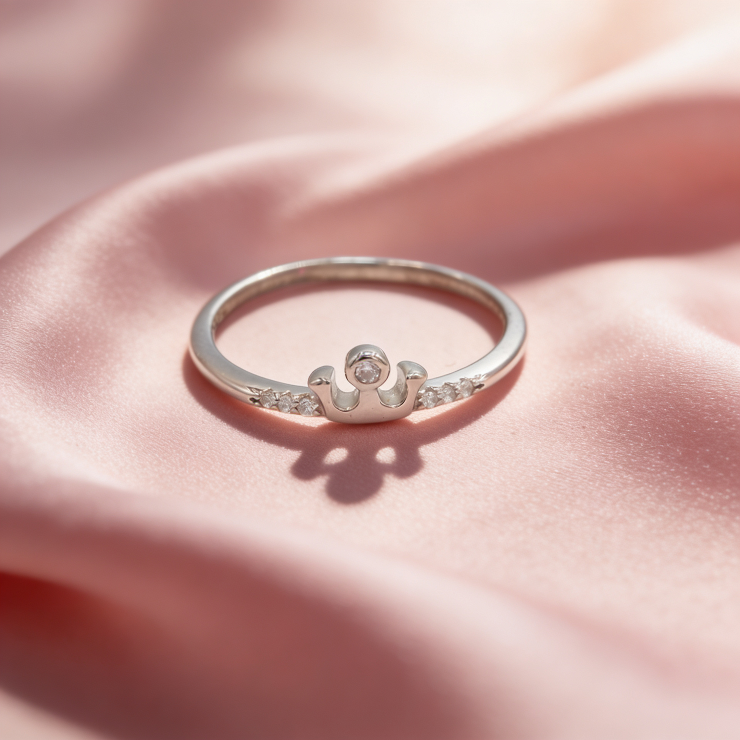 Rani 925 silver crown sparkle ring for women by Zyrene on pink satin background