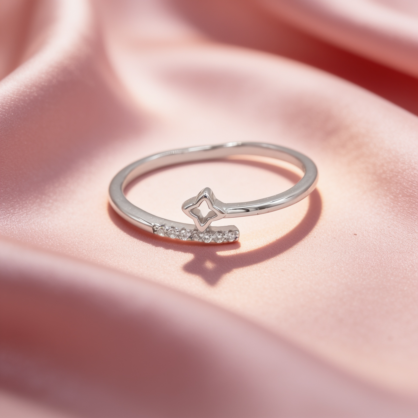 Sitara 925 silver star sparkle ring for women by Zyrene on pink satin background