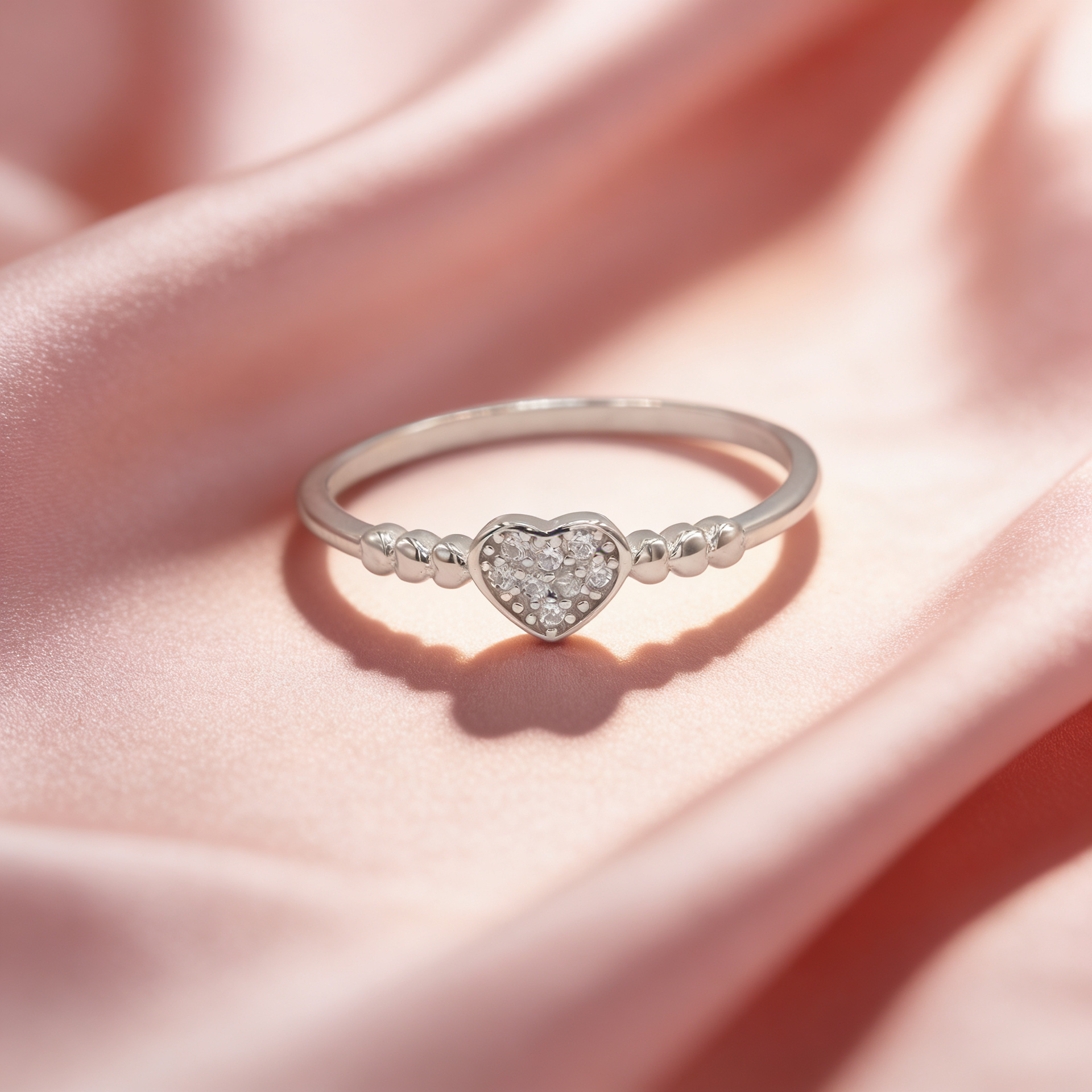 Siya 925 silver beaded heart ring for women by Zyrene on pink satin background