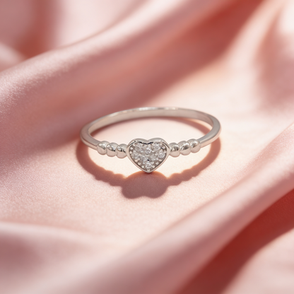Siya 925 silver beaded heart ring for women by Zyrene on pink satin background