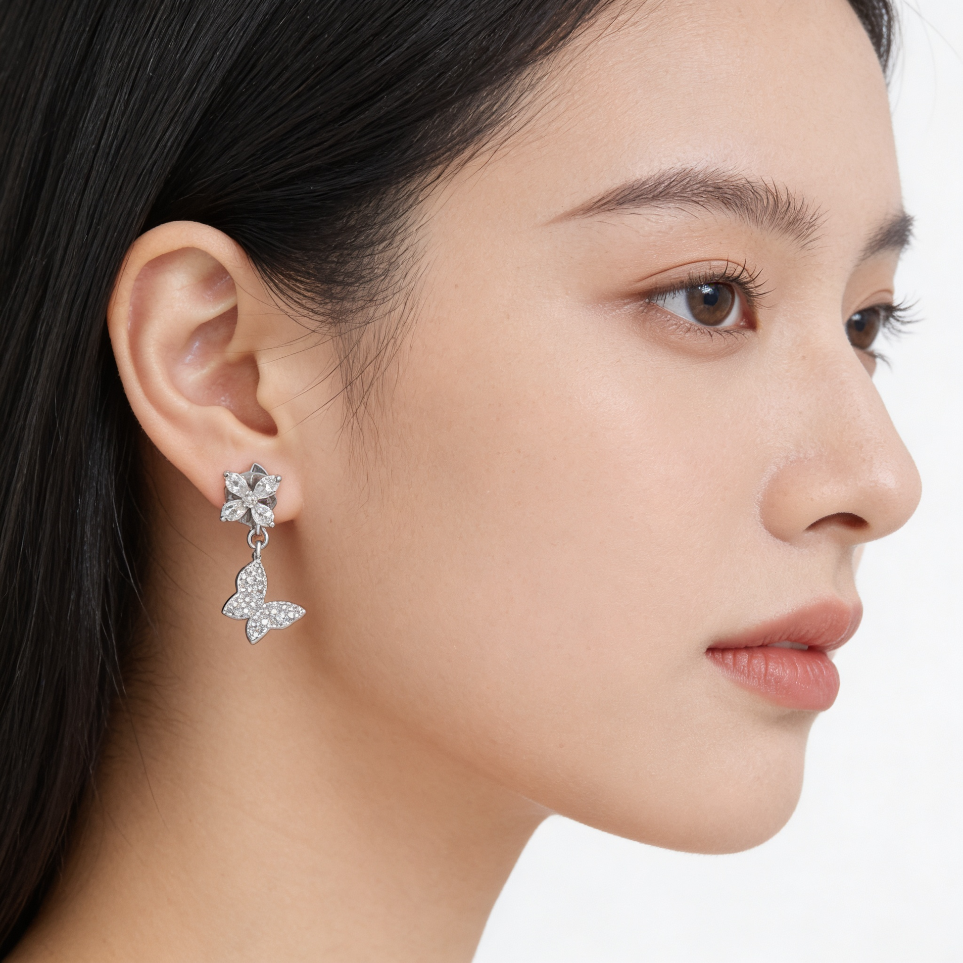 Zyrene 925 silver butterfly drop earrings worn for festive styling